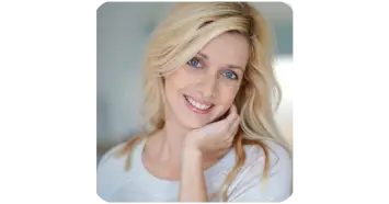 Linda K smiling customer giving positive ear health product review